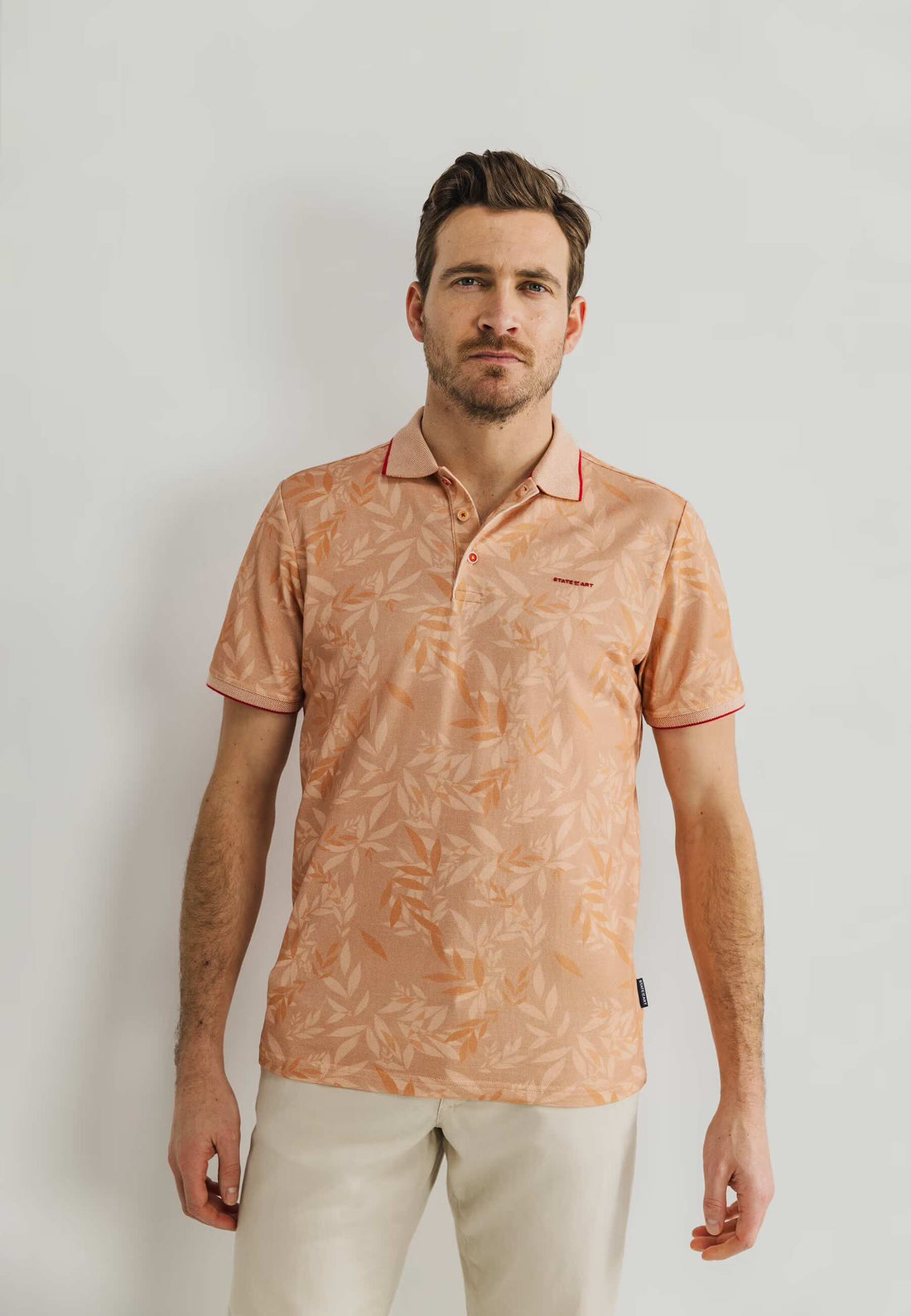 Polo botanische print - mango/brique